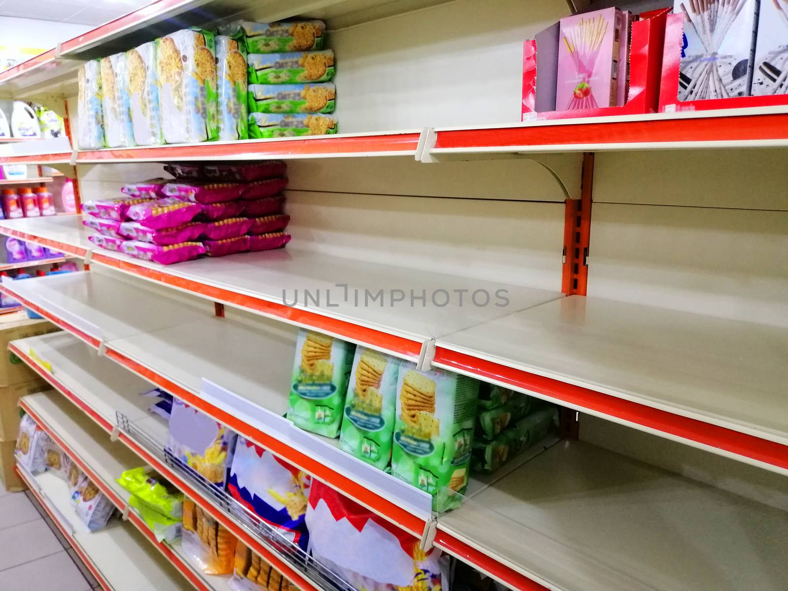 Empty shelves in a supermarket in malaysia due to people panicking and hoarding