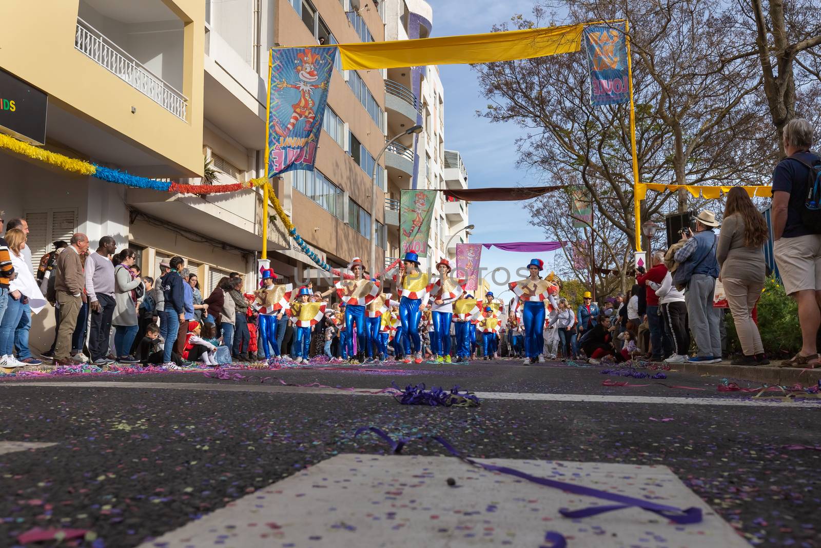 Loule, Portugal - February 25, 2020: dancers parading in the street in front of the public in the parade of the traditional carnival of Loule city on a February day