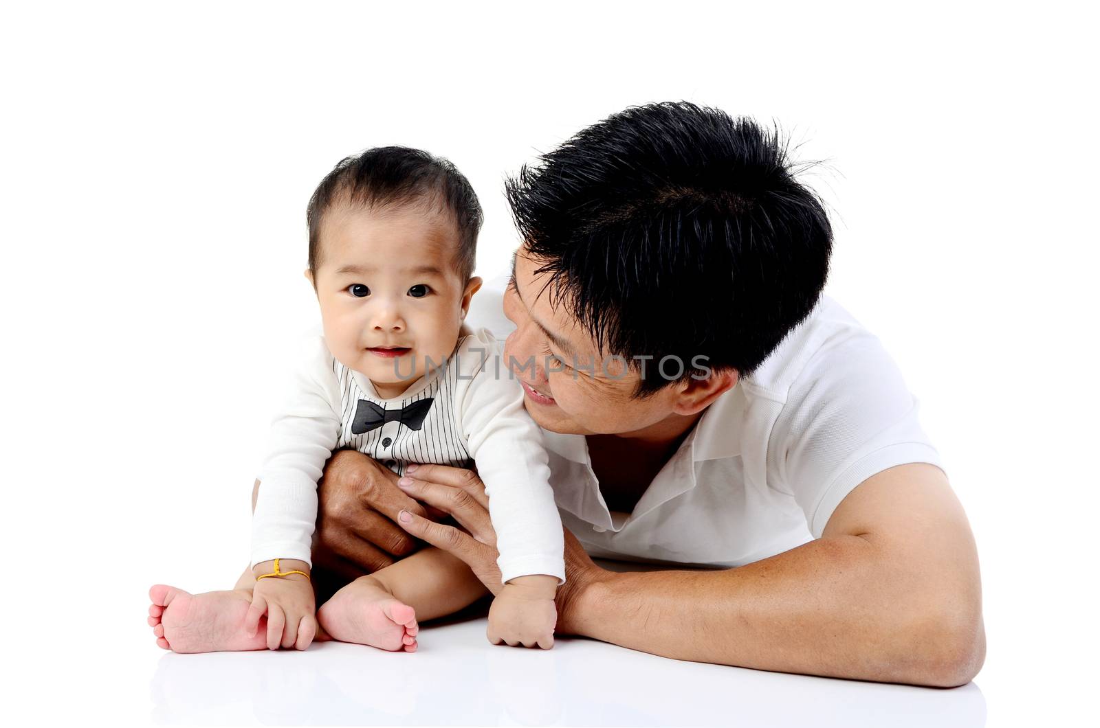 Asian father playing with his baby boy
