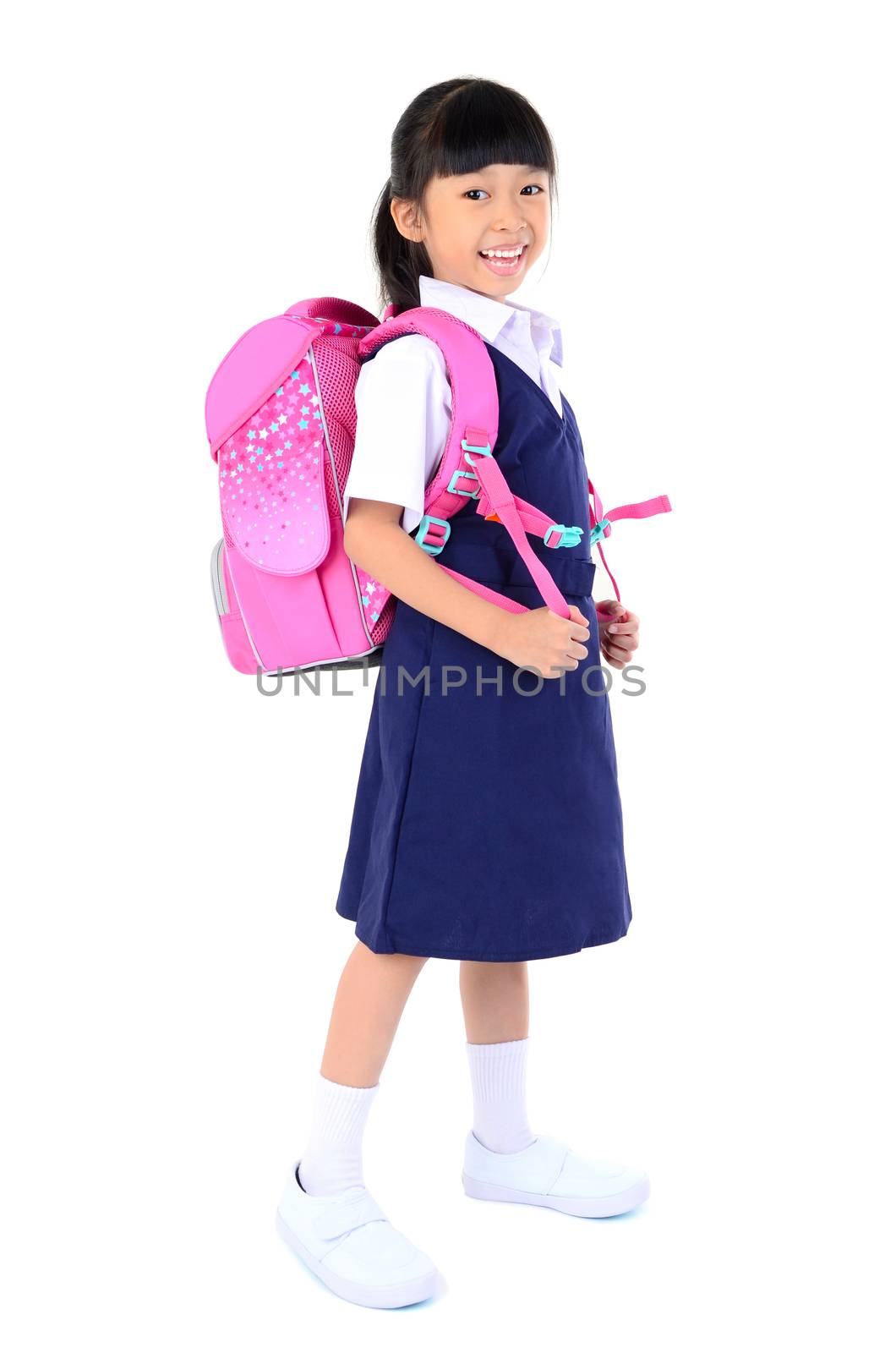Portrait of Asian child in school uniform with school bag on white background isolated.