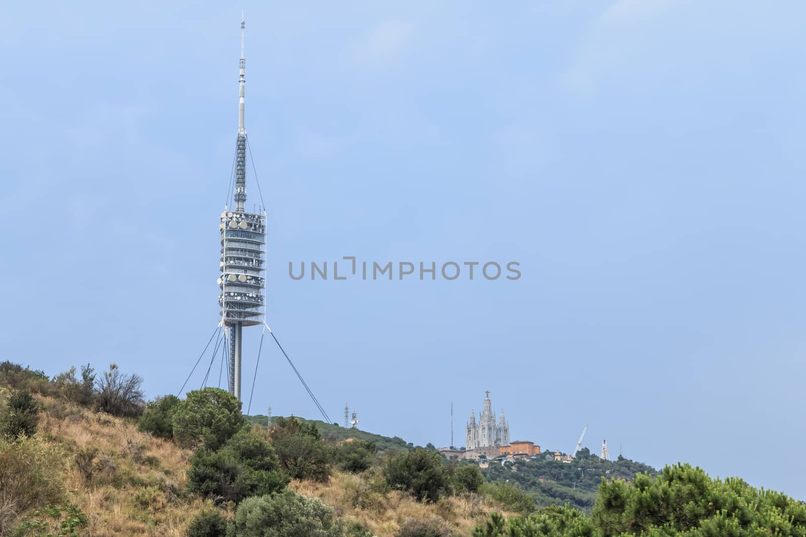 Barcelona, Spain - June 21, 2017: View of the Collserola telecommunications tower on the heights of Barcelona on a summer day