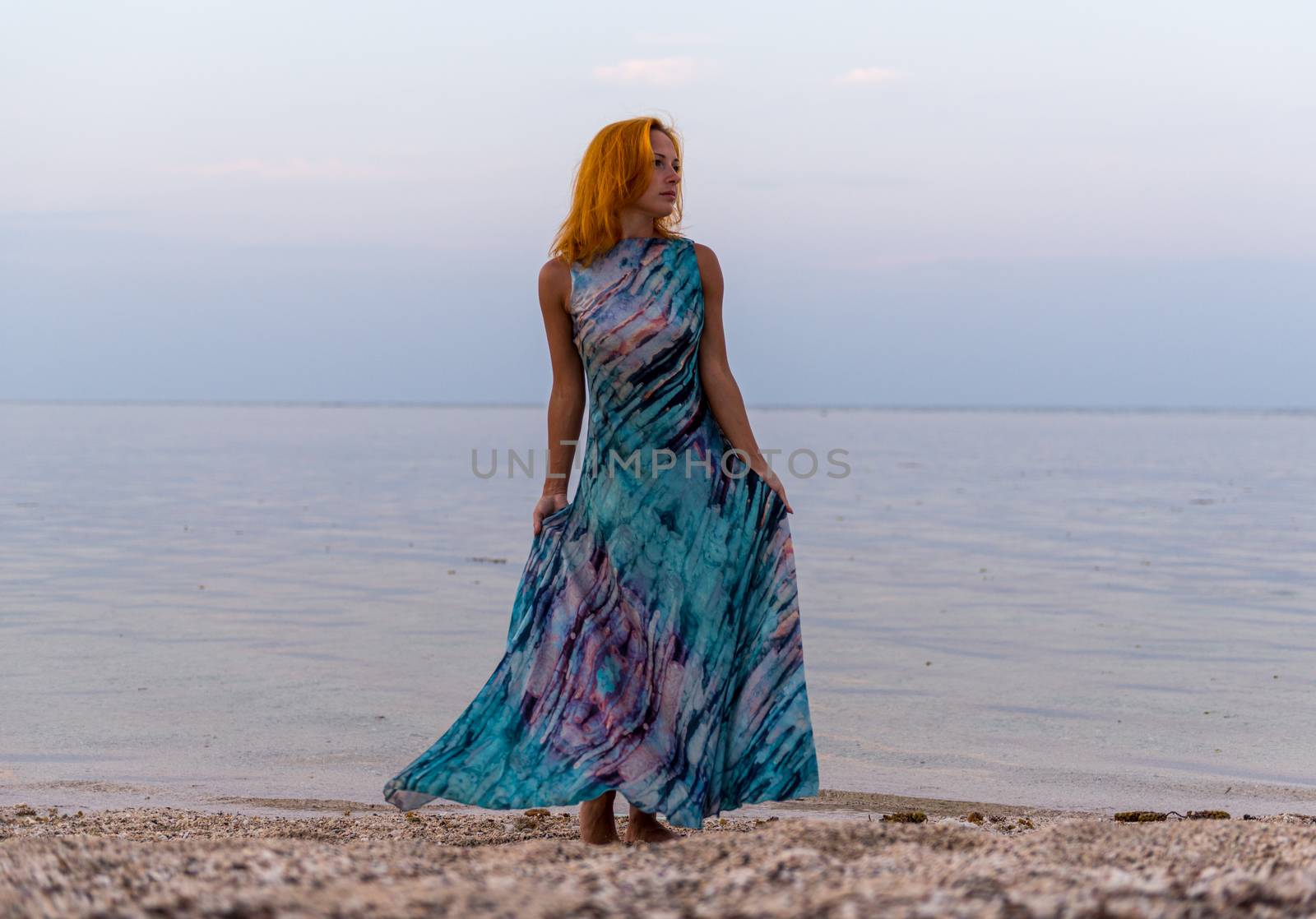 Young red woman on a beach by nikitabuida