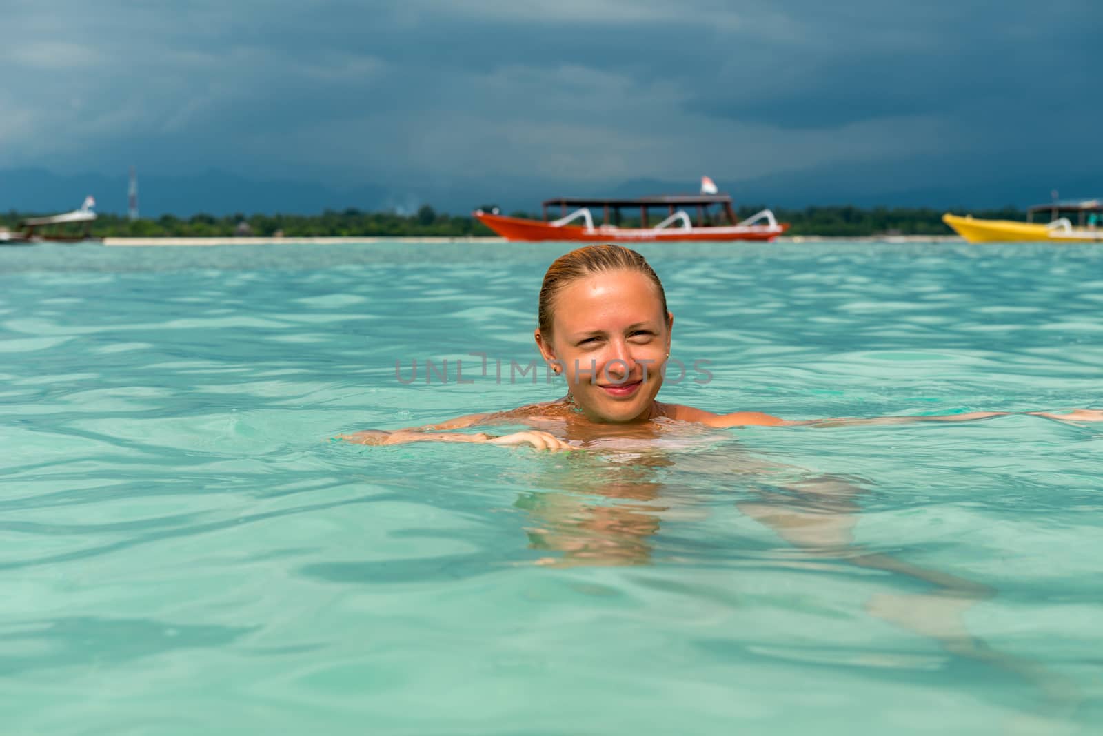 Woman at tropical island beach by nikitabuida