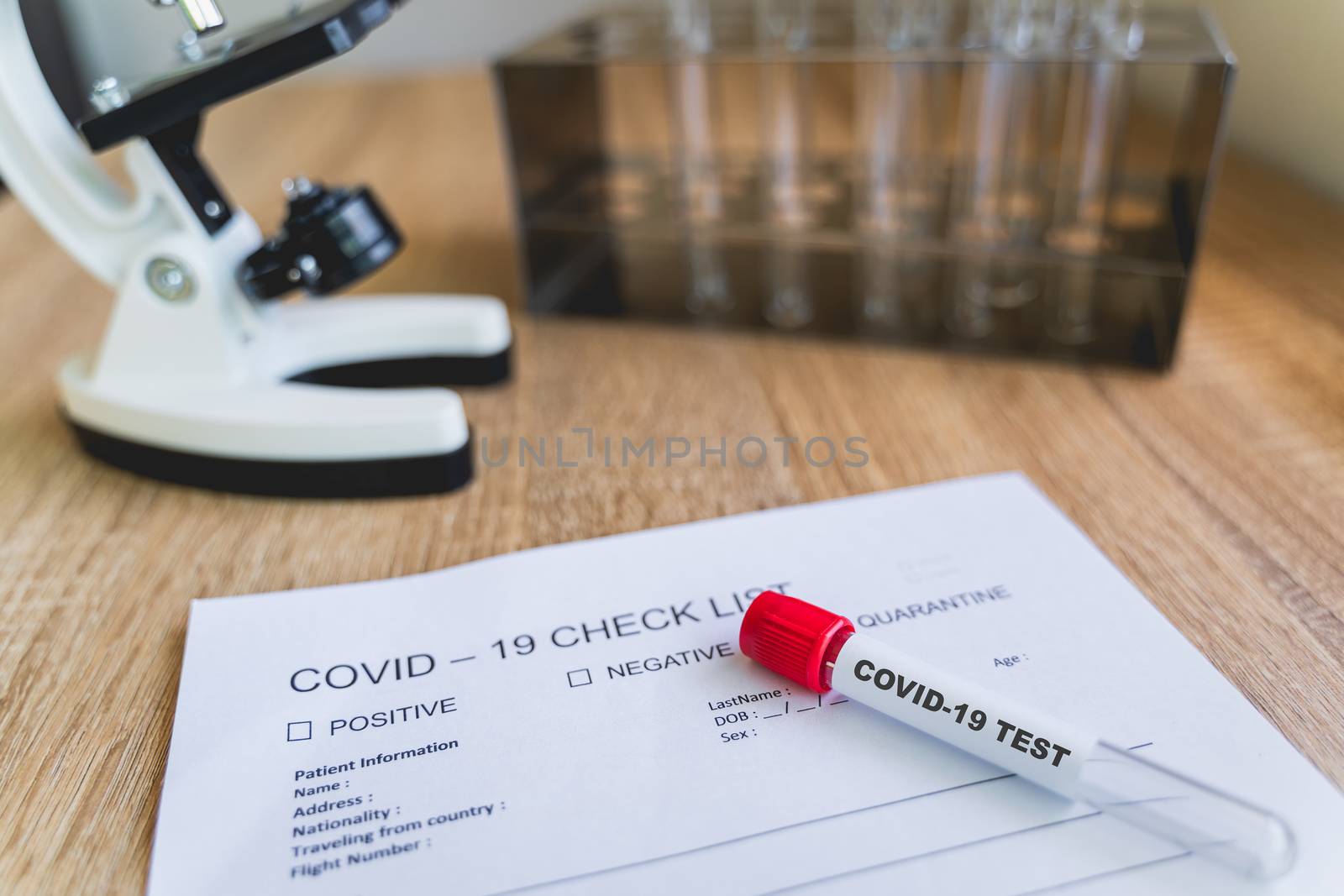 COVID19 Check List and blood test tube to detect corona virus in by Boophuket