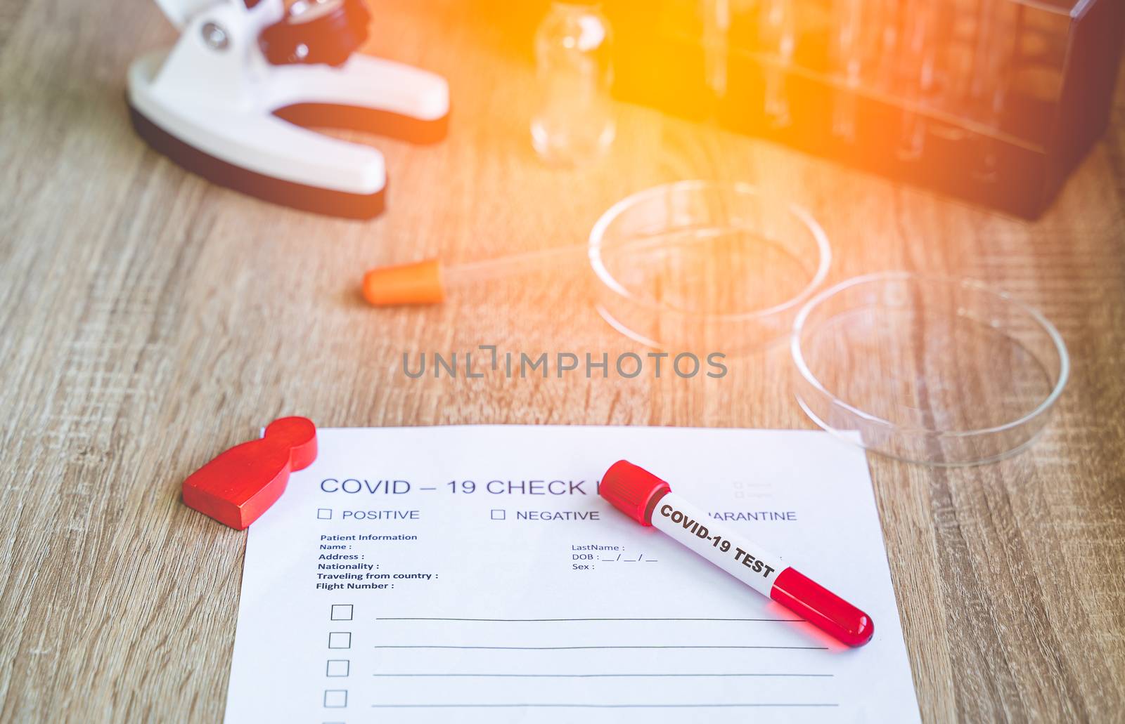 COVID19 Check List and blood test tube to detect corona virus in by Boophuket