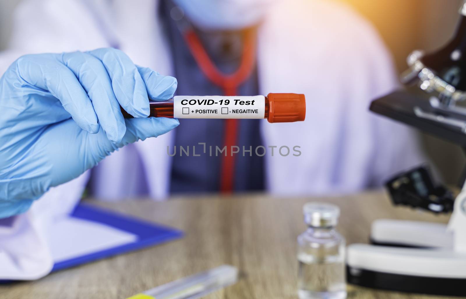 Close up The doctor's hand holds the patient's blood test result by Boophuket