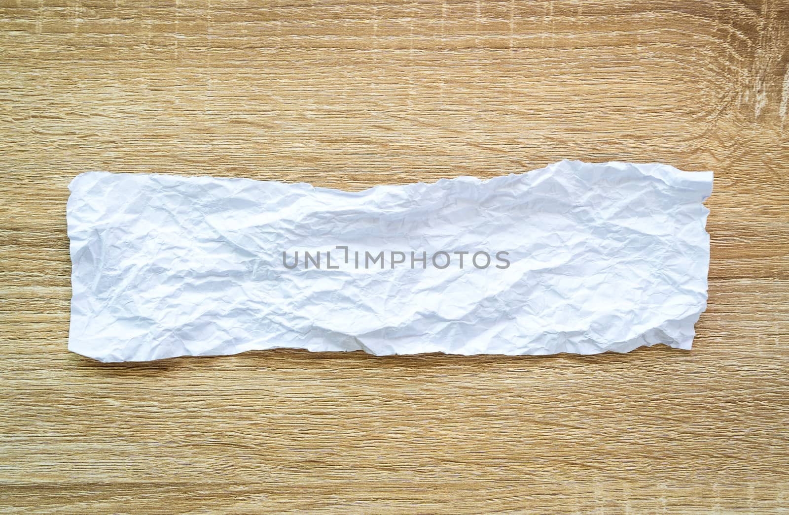 Abstract white Crumpled Paper texture on woodden table backgroun by Boophuket