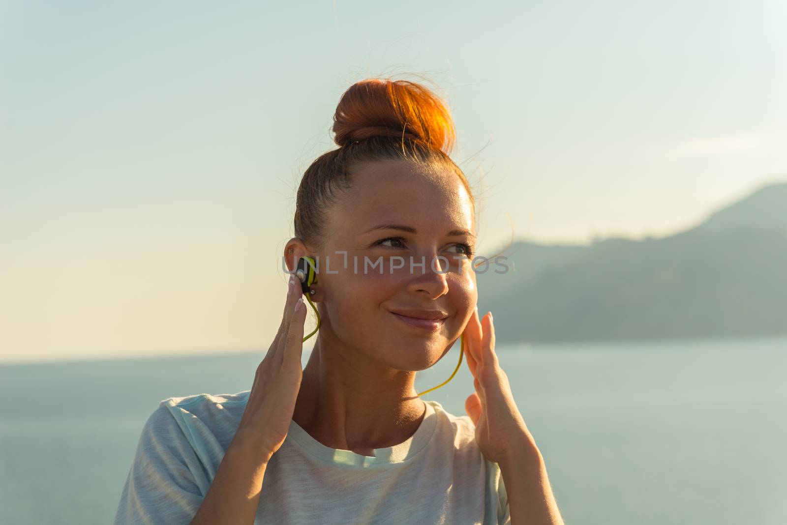 Fitness girl with wireless headphones by nikitabuida