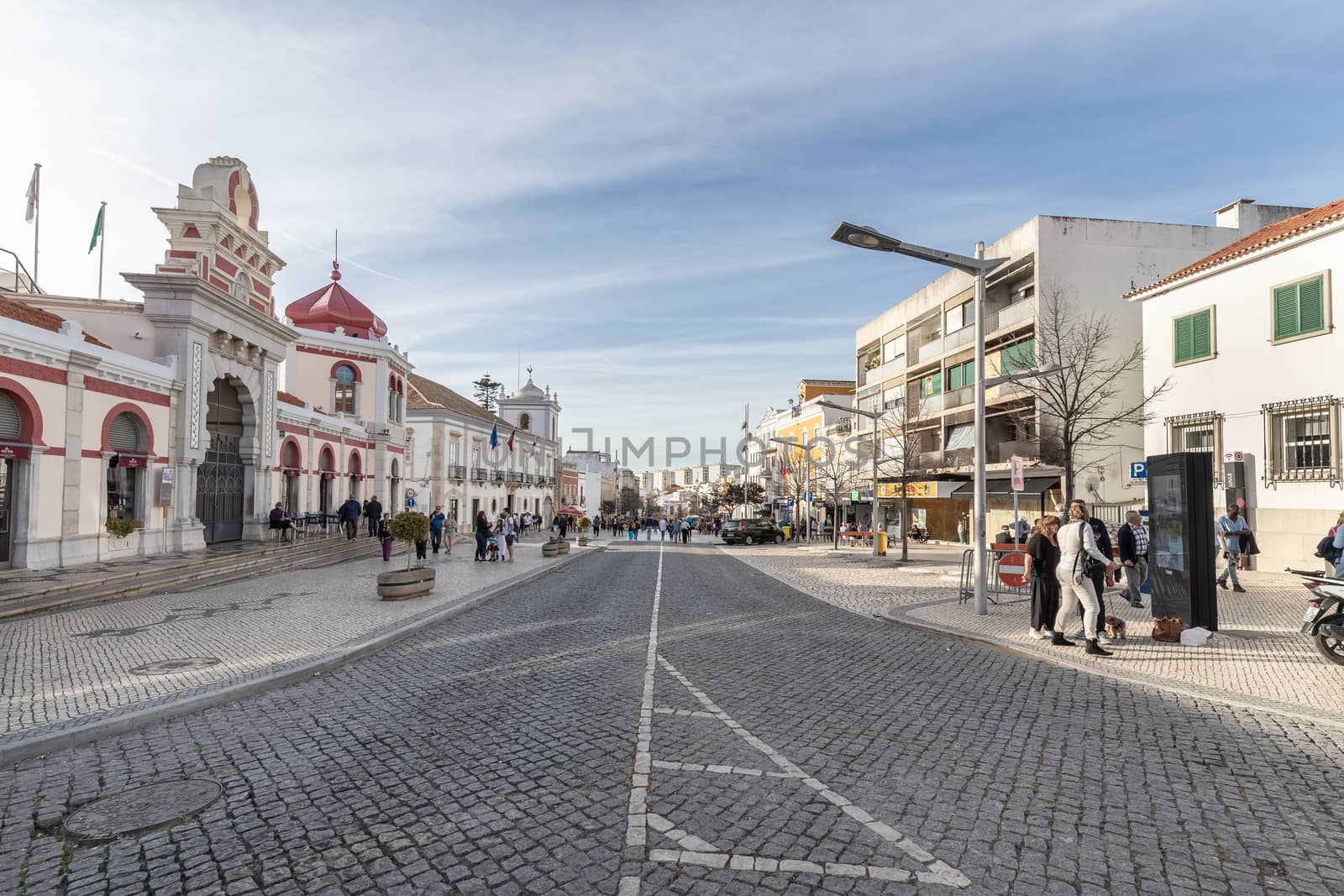 people walking in front of the city's municipal market  of Loule by AtlanticEUROSTOXX