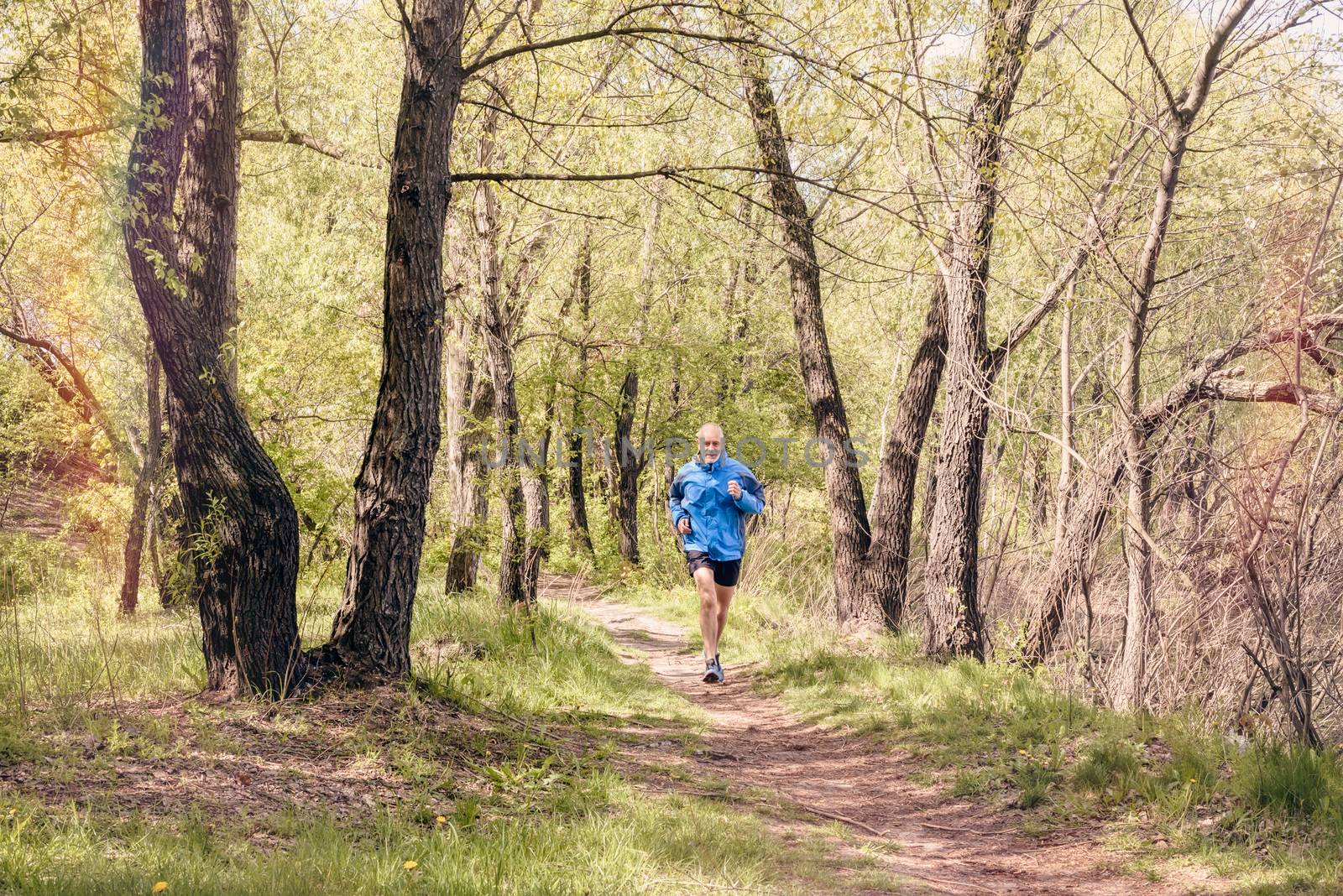 Senior Man Running in the Forest by MaxalTamor