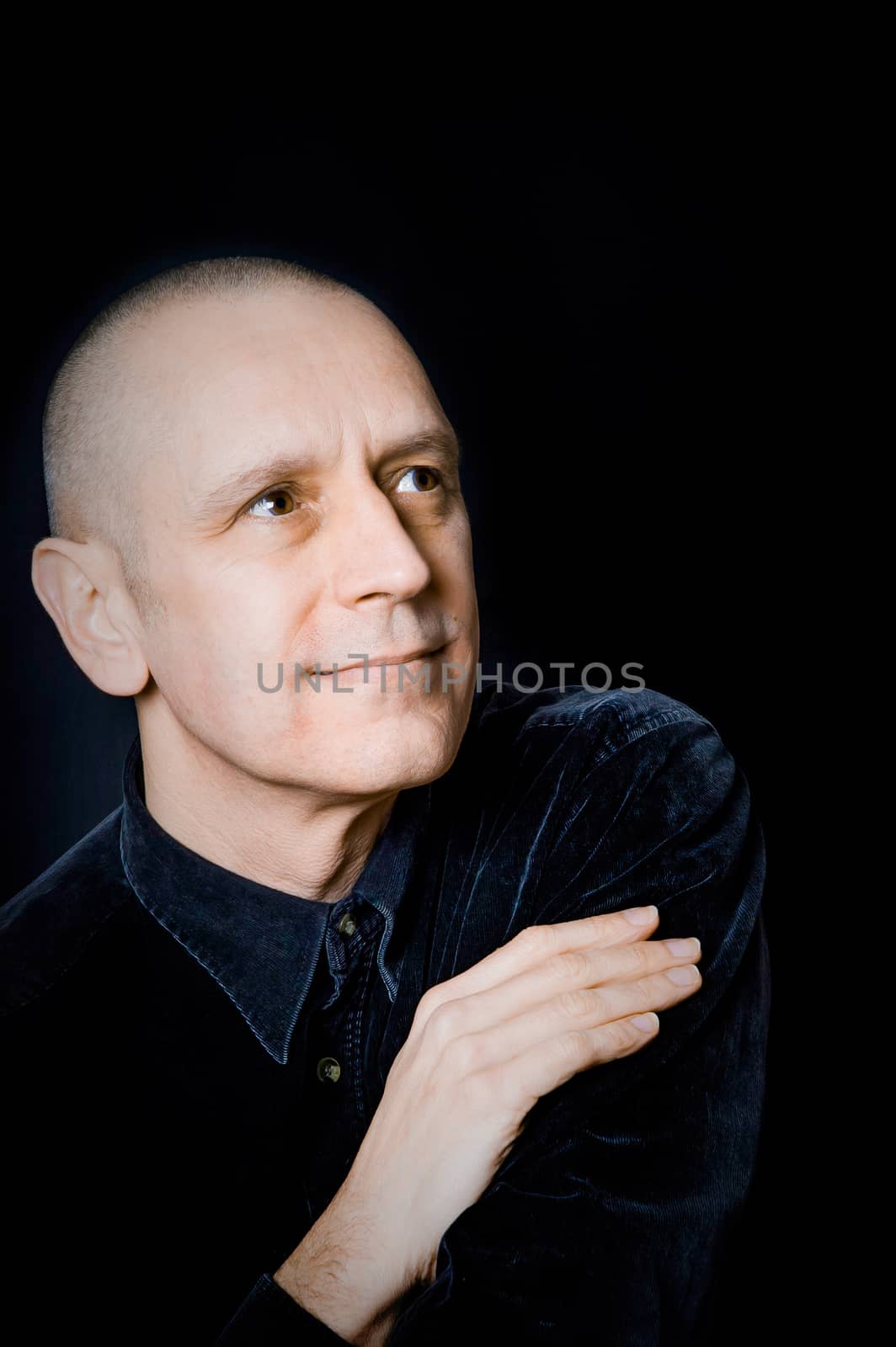 Portrait of a caucasian man on black background