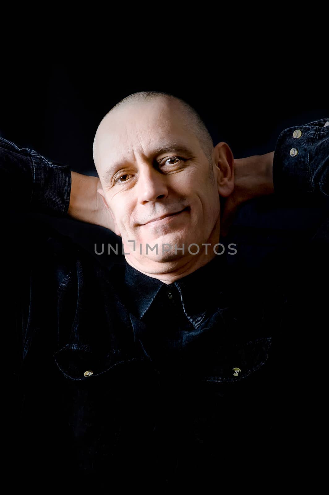 Portrait of a caucasian man on black background