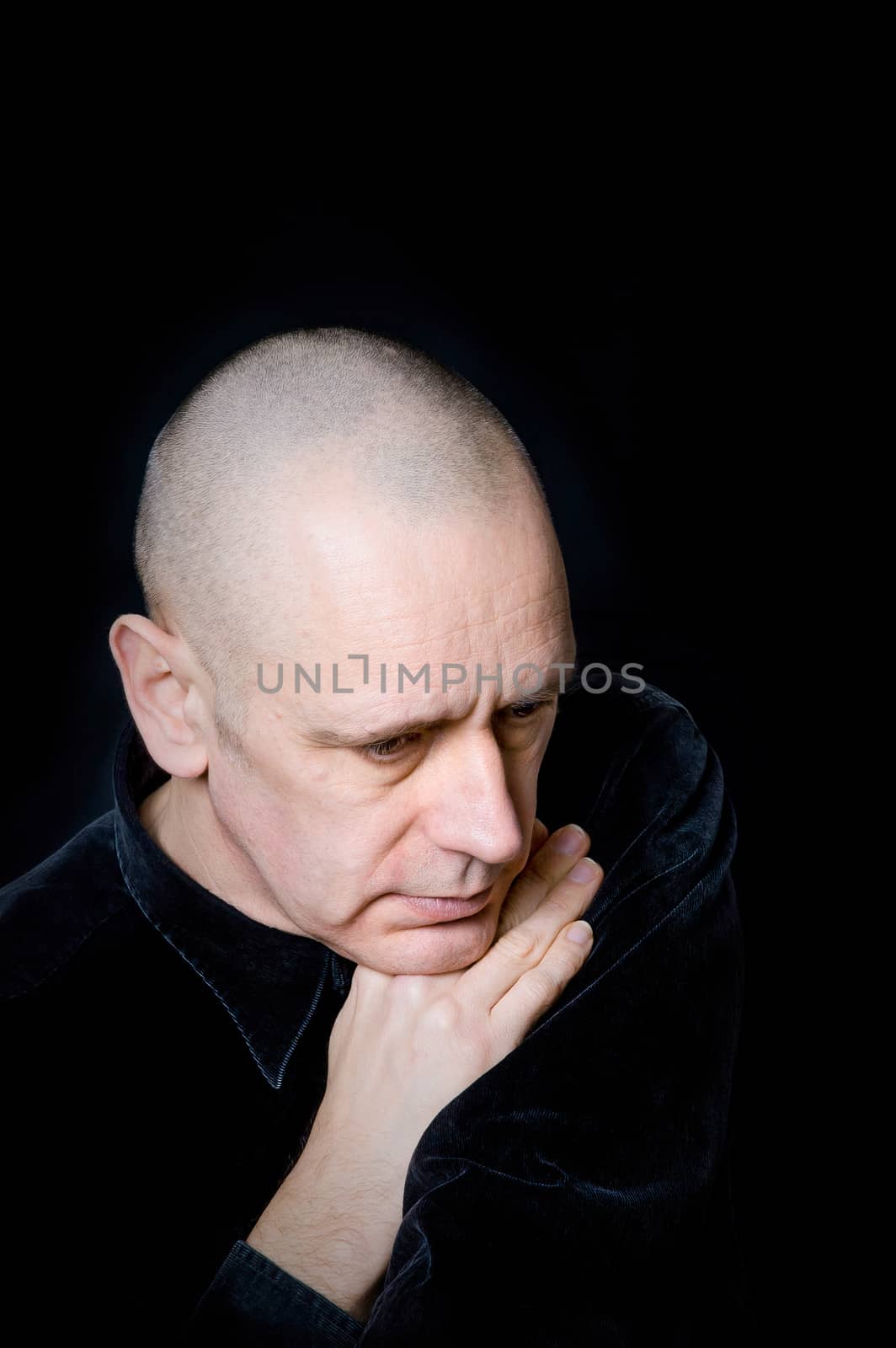 Portrait of a caucasian man on black background