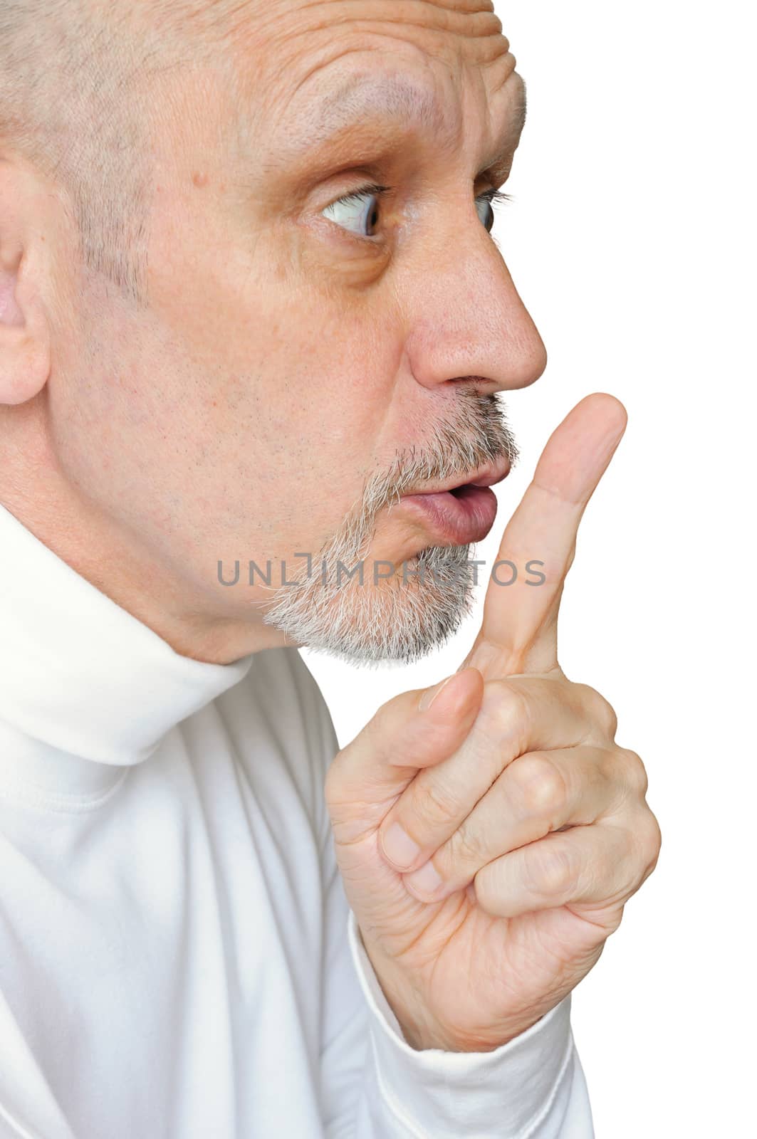 Man intimating silence, making "hush!" with the finger in front of the lips