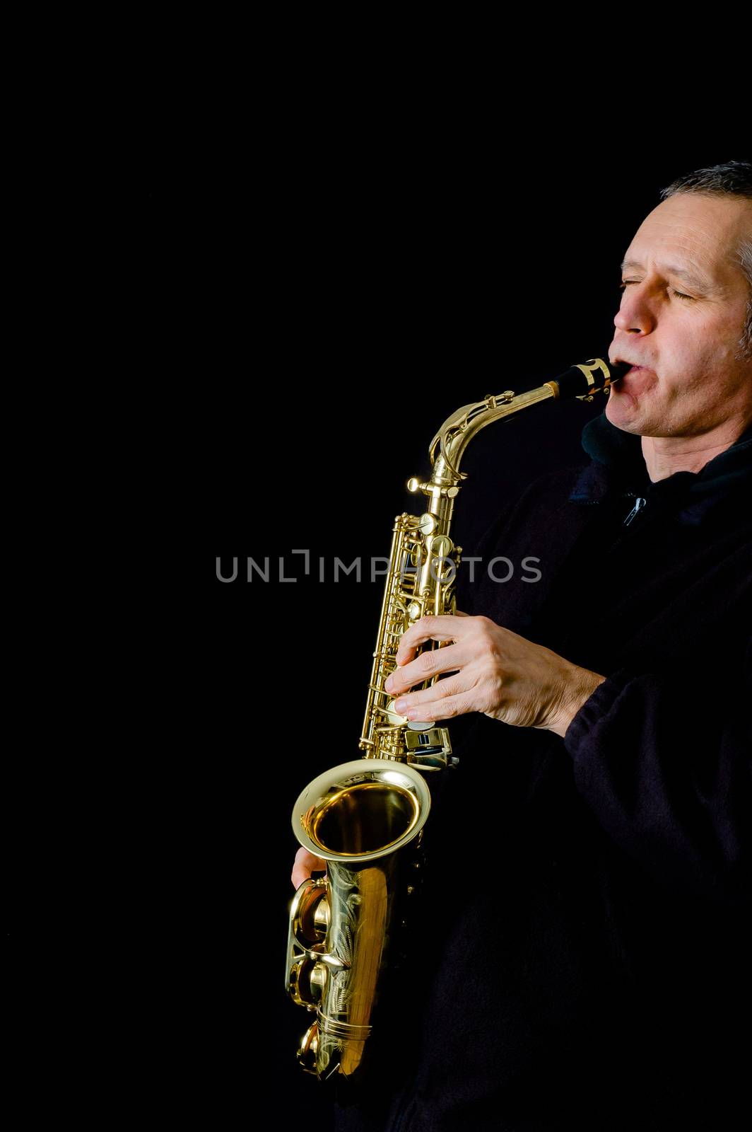 A Musician playing jazz music on his saxophone