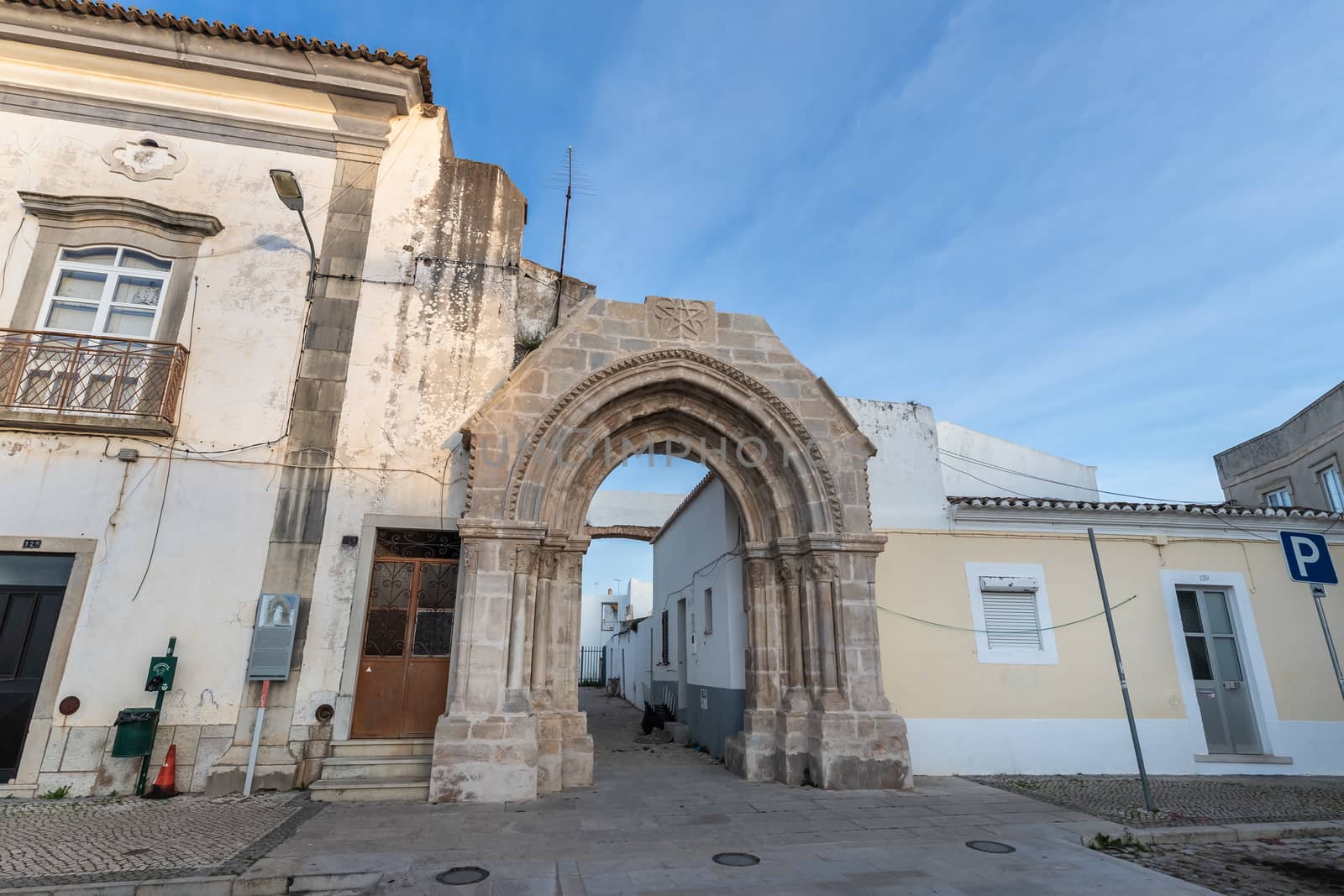 Loule, Faro, Portugal - February 25, 2020: architectural detail of the remains of the door of the old monastery of Saint Francis (Convento da Graça) in the historic city center on a winter day