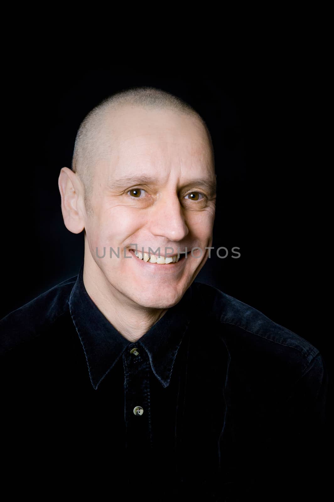 Portrait of a caucasian man on black background