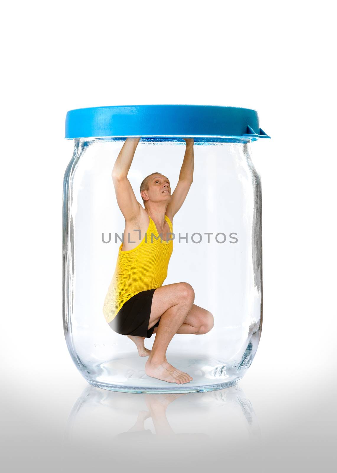 A man trapped in a glass jar  with the closed blue color lid