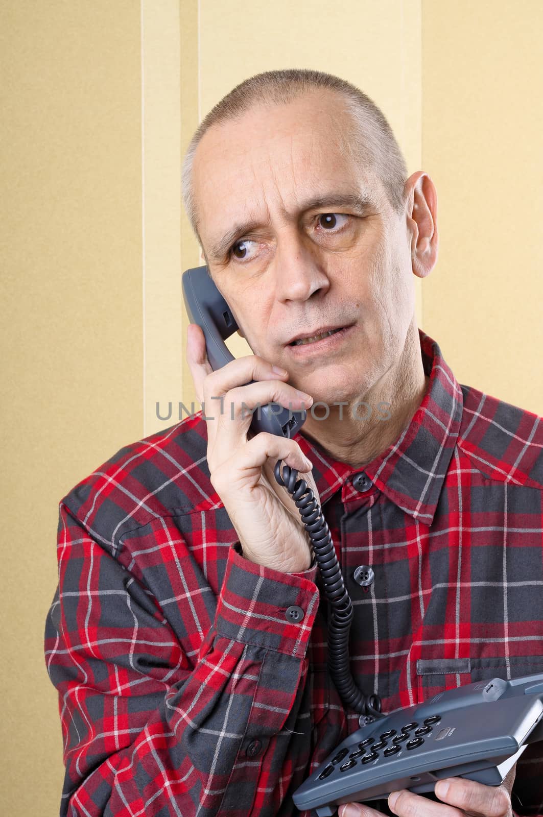 Troubled man speaking about problems on phone