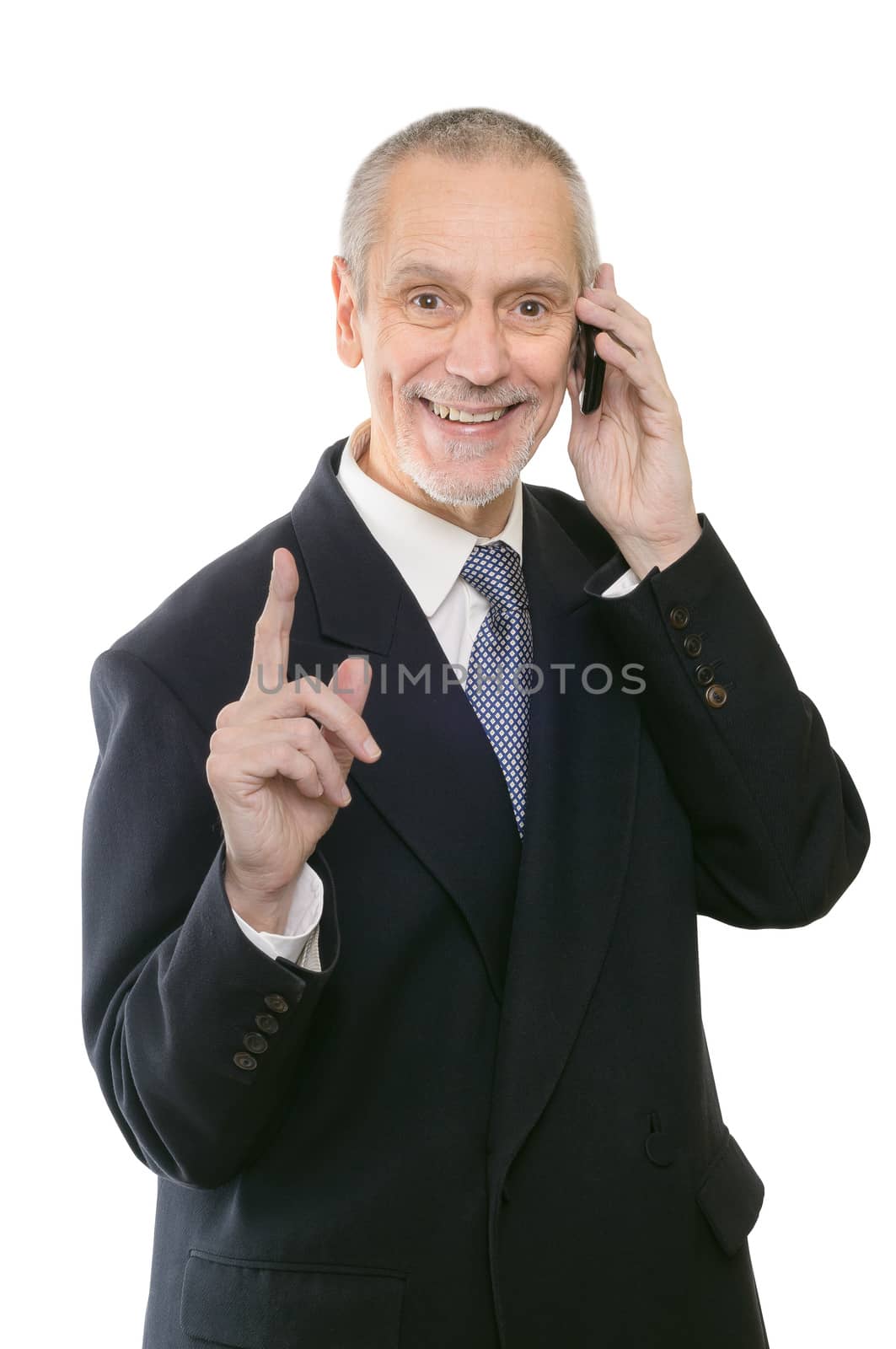 A gentle businessman smiling on mobile phone and showing the forefinger