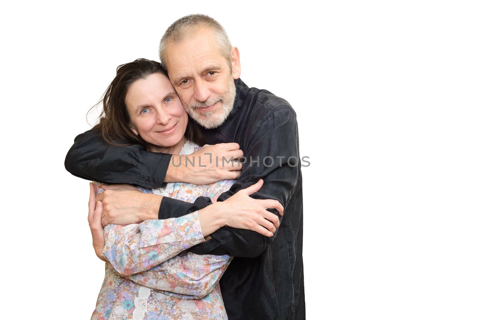 Happy mature man and woman smiling for S. Valentine's day or anniversary and embracing each other. Isolated on white background.