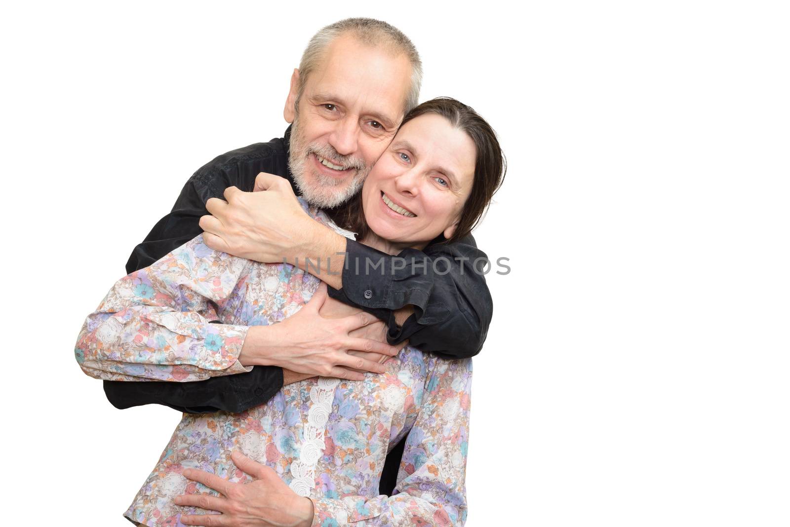 Happy mature man and woman smiling for S. Valentine's day or anniversary and embracing each other. Isolated on white background.