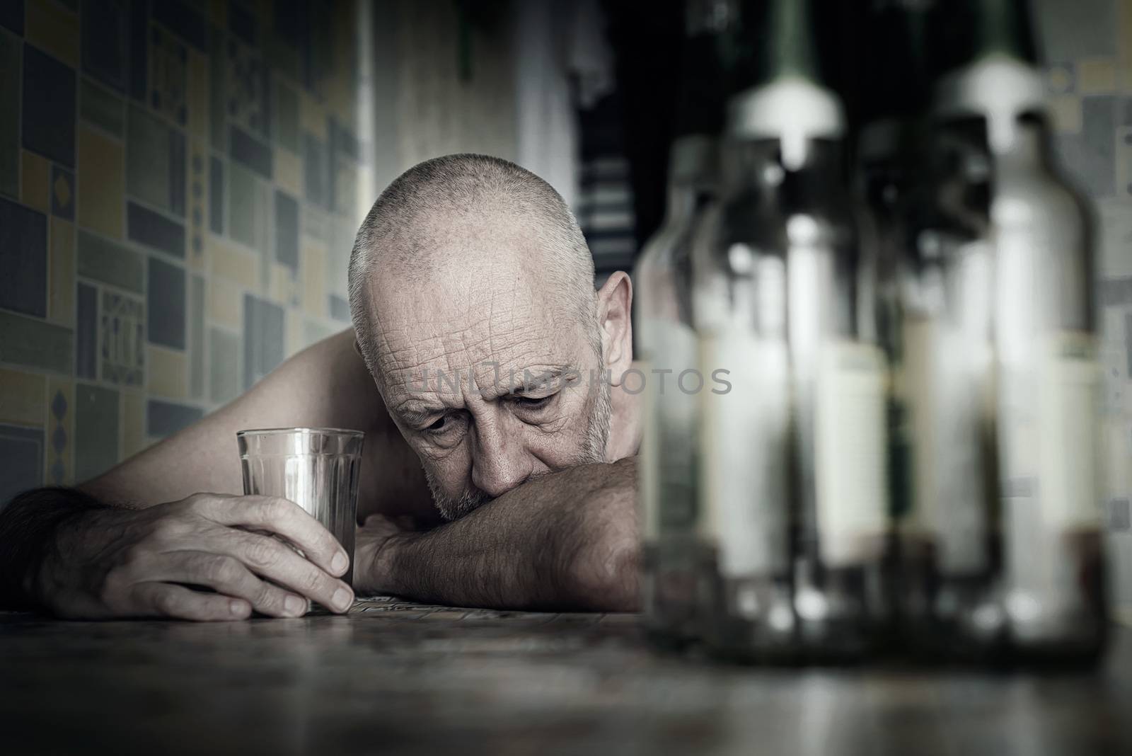 A desperate man falls into depression and becomes alcoholic and miserable. His addiction leads him to a state of loneliness and poverty. He has no hope and could be suicidal.