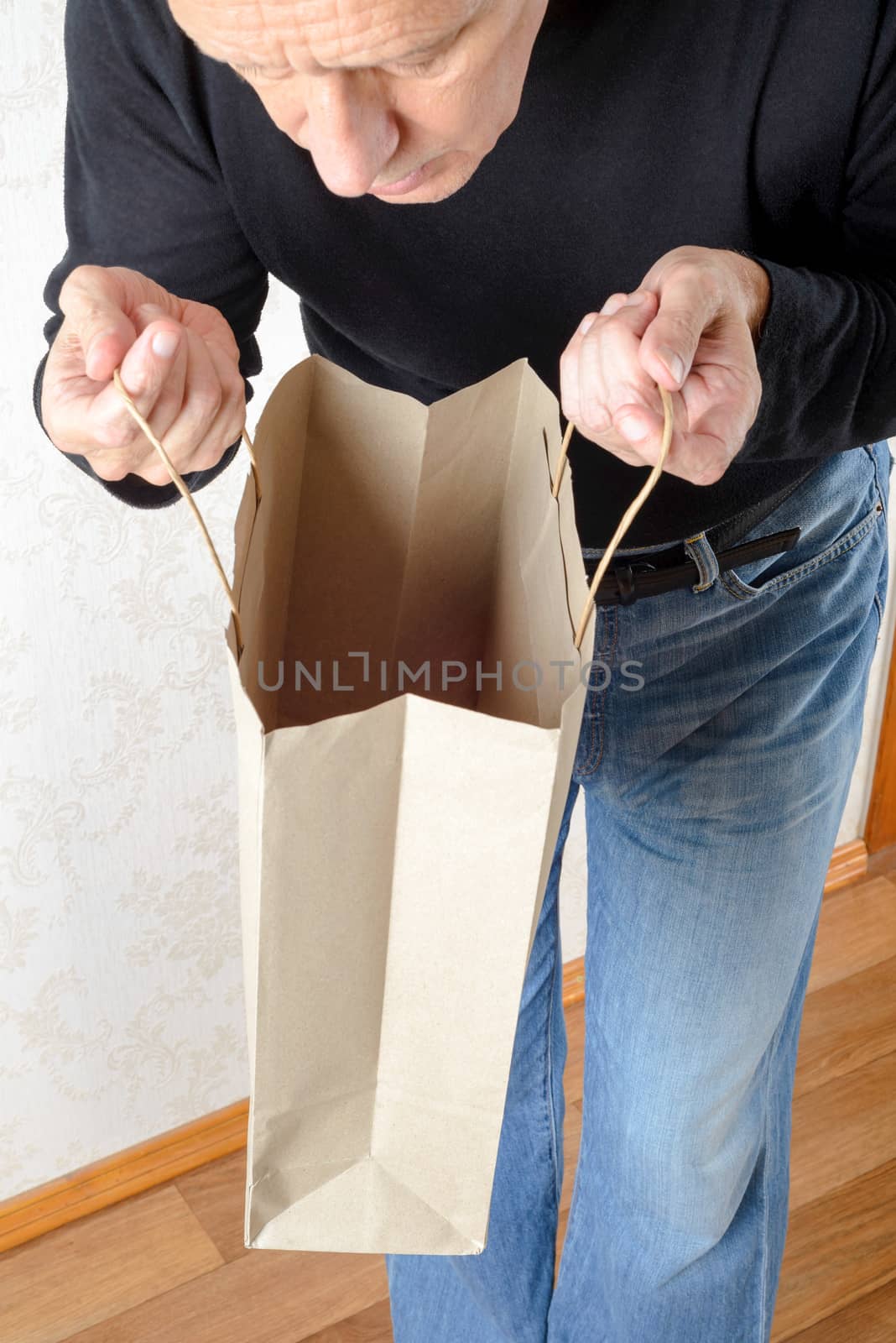 Man Looking Inside a Paper Bag by MaxalTamor