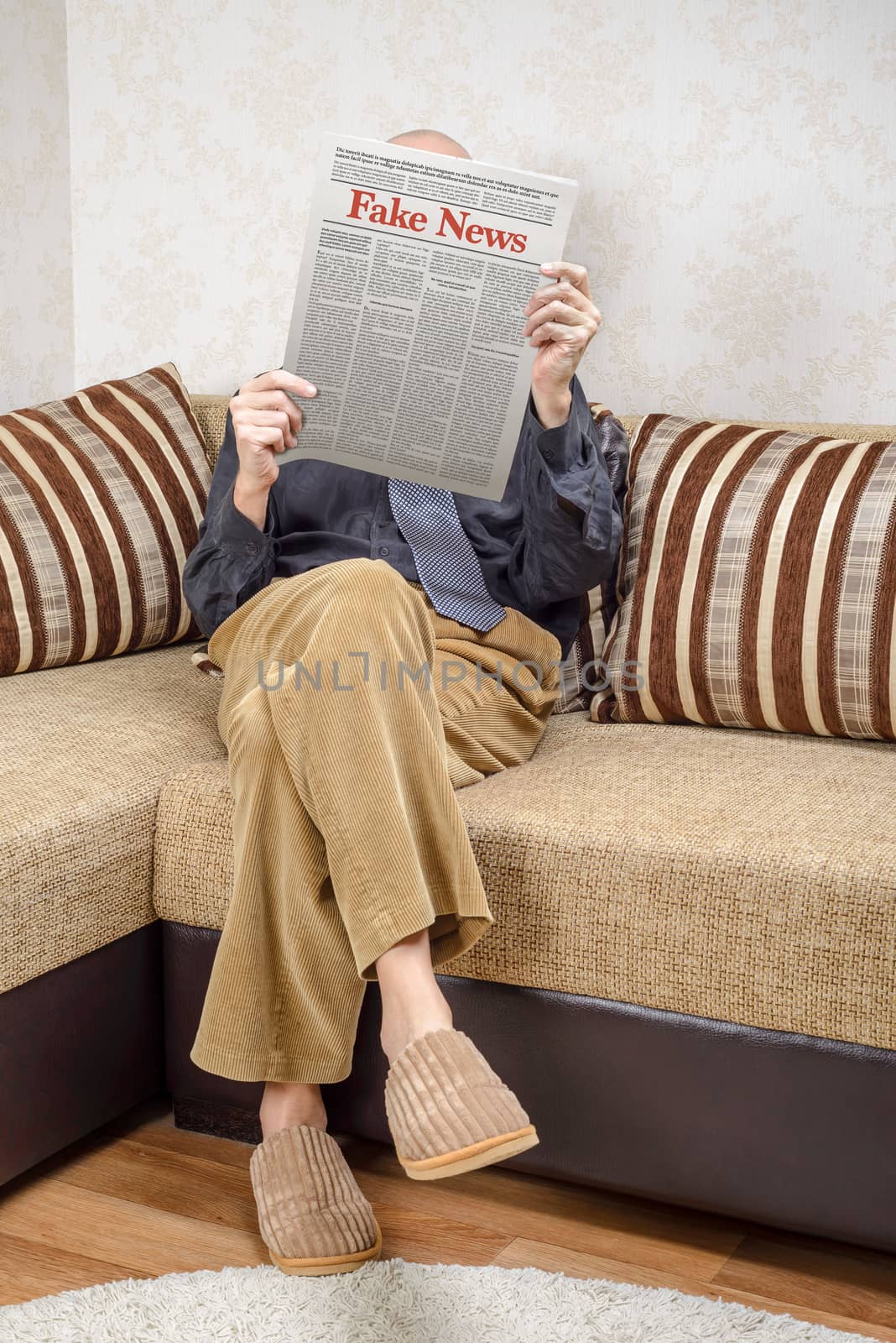 Man reading fake news on a daily paper by MaxalTamor