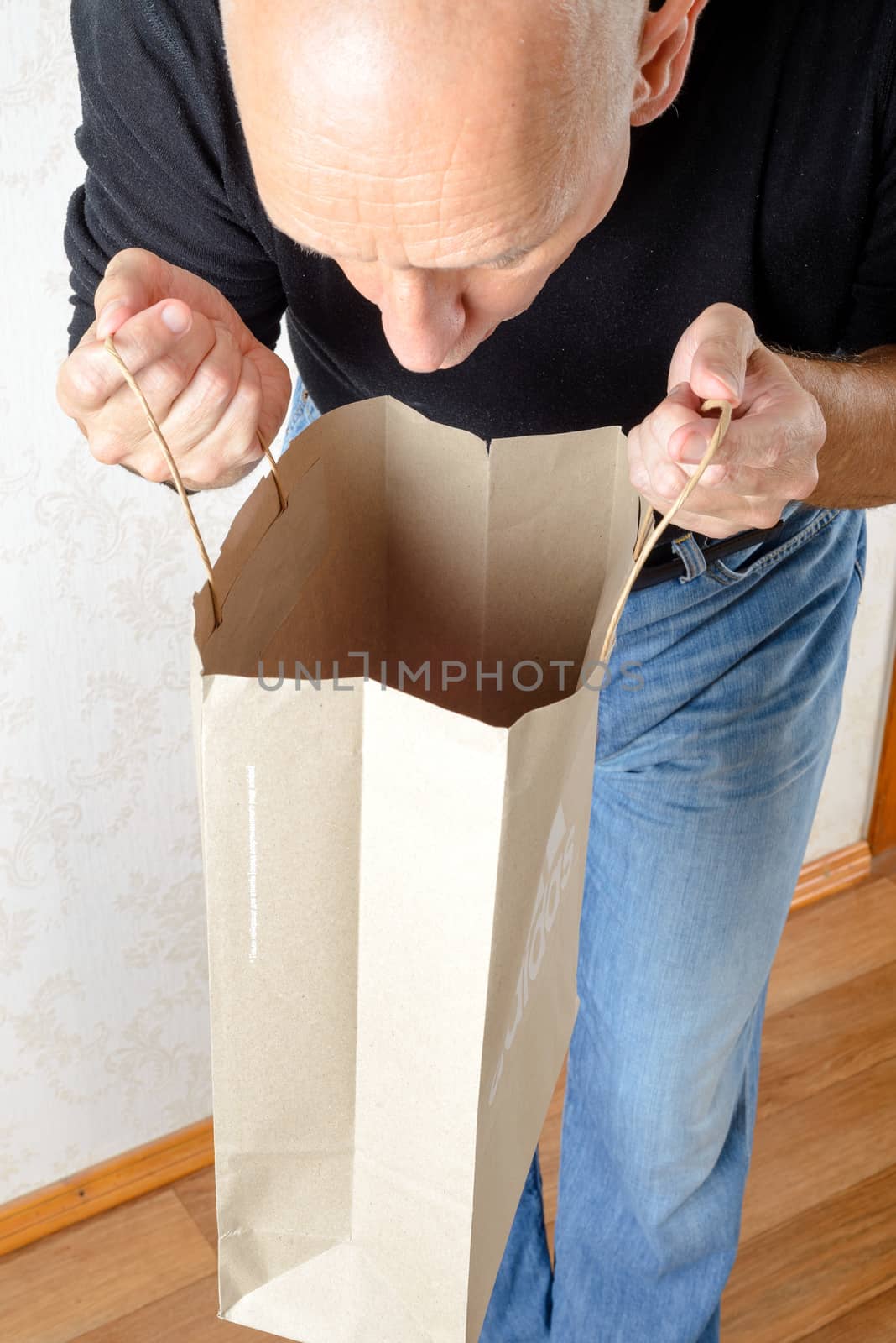 Man Looking Inside a Paper Bag by MaxalTamor