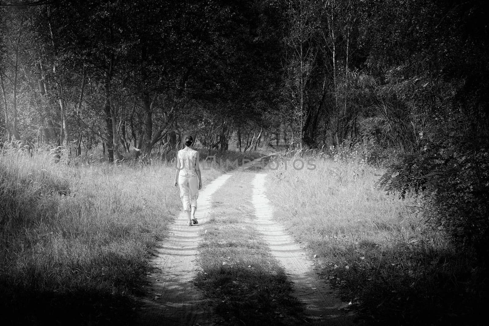 Adult woman is walking in the forest by MaxalTamor
