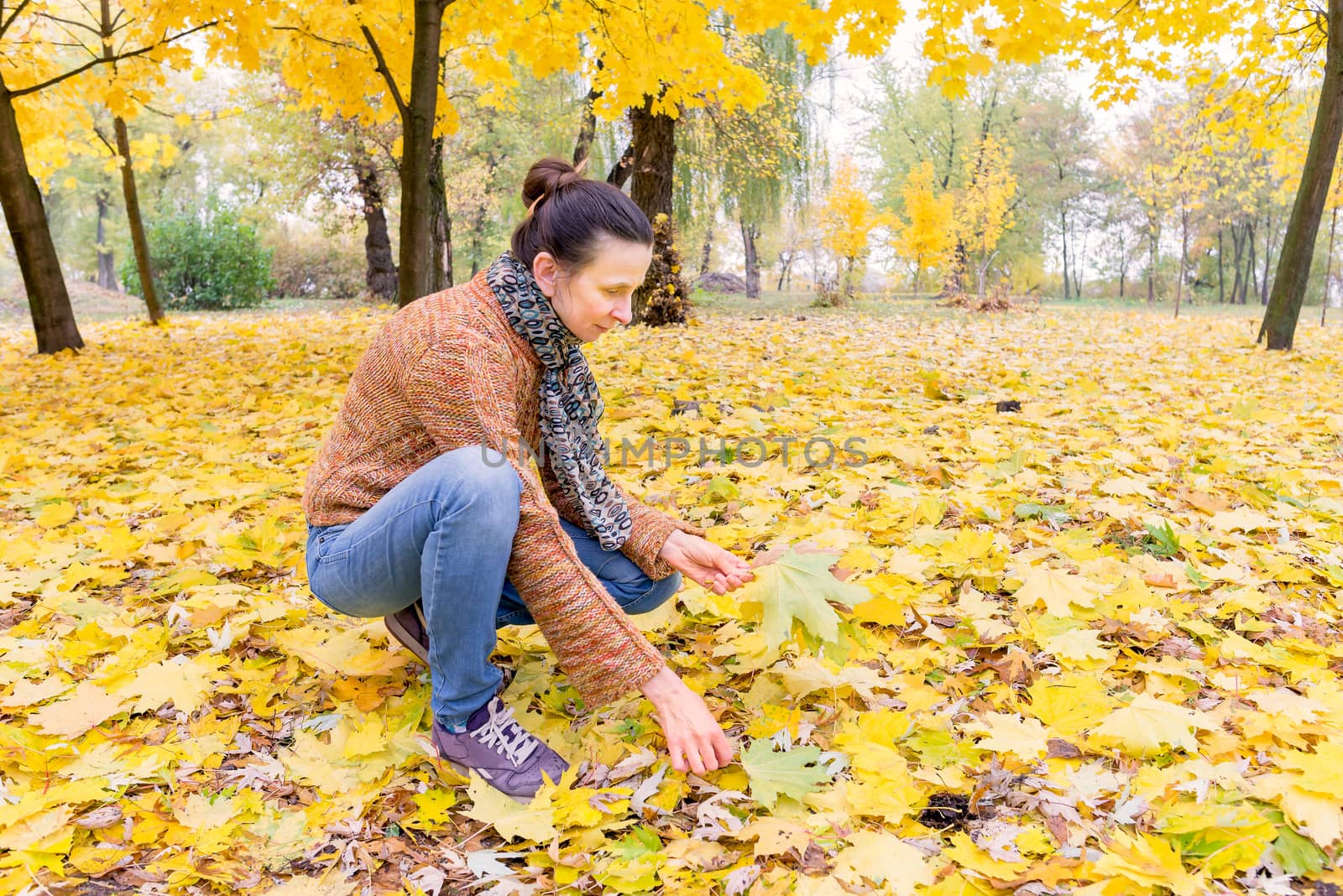 Woman Picking Leaves in Autumn by MaxalTamor