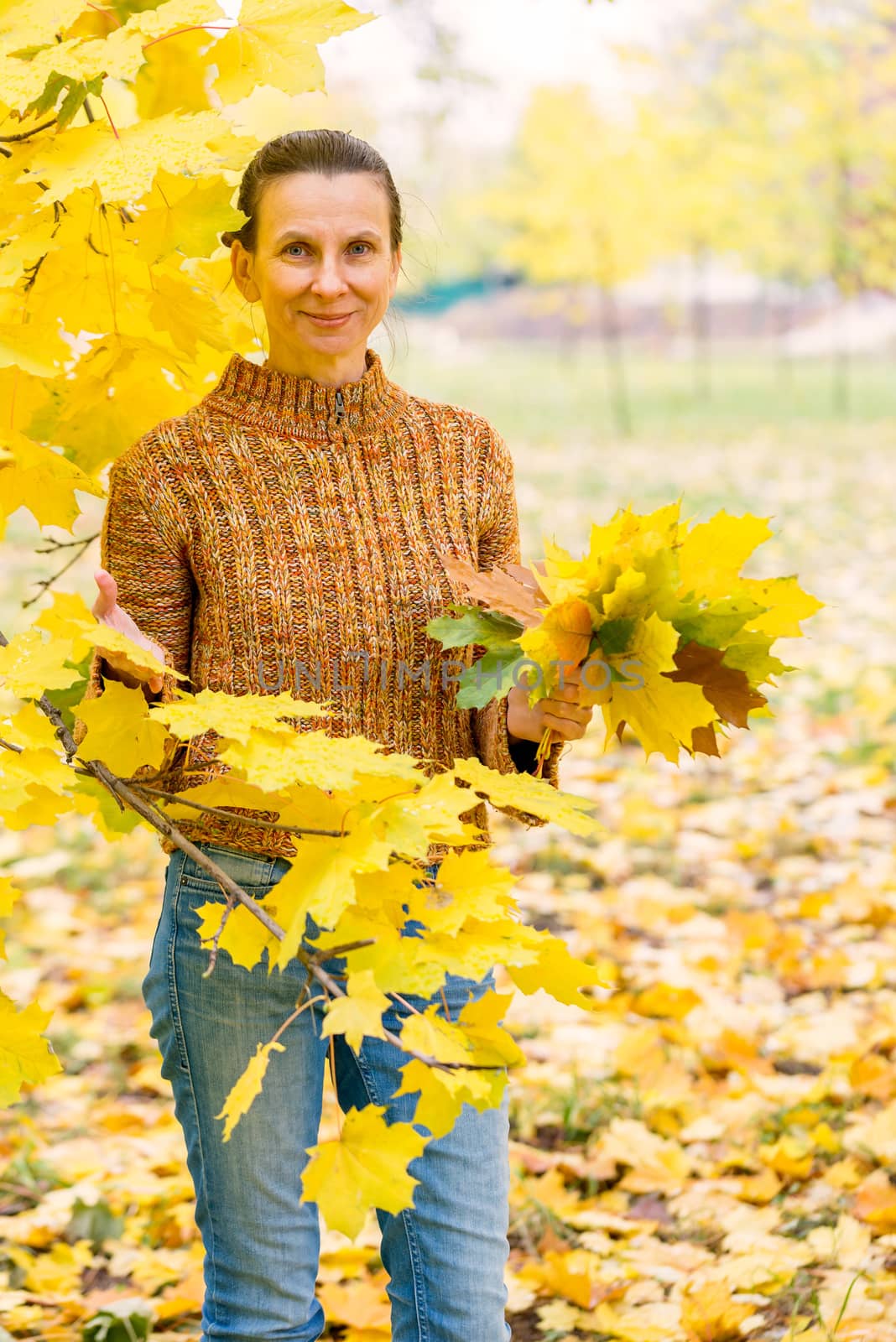 Woman Picking Leaves in Autumn by MaxalTamor