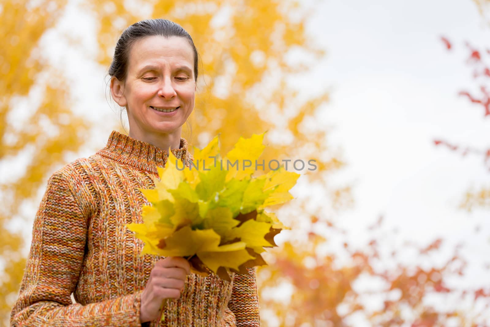 Woman Picking Leaves in Autumn by MaxalTamor