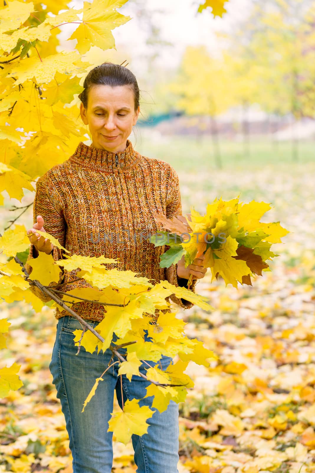 Woman Picking Leaves in Autumn by MaxalTamor