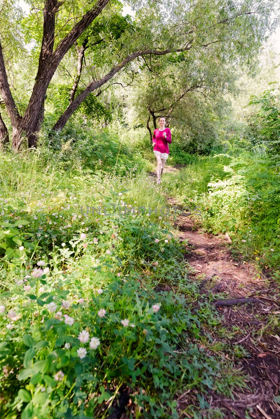 Senior Woman Running in the Forest by MaxalTamor