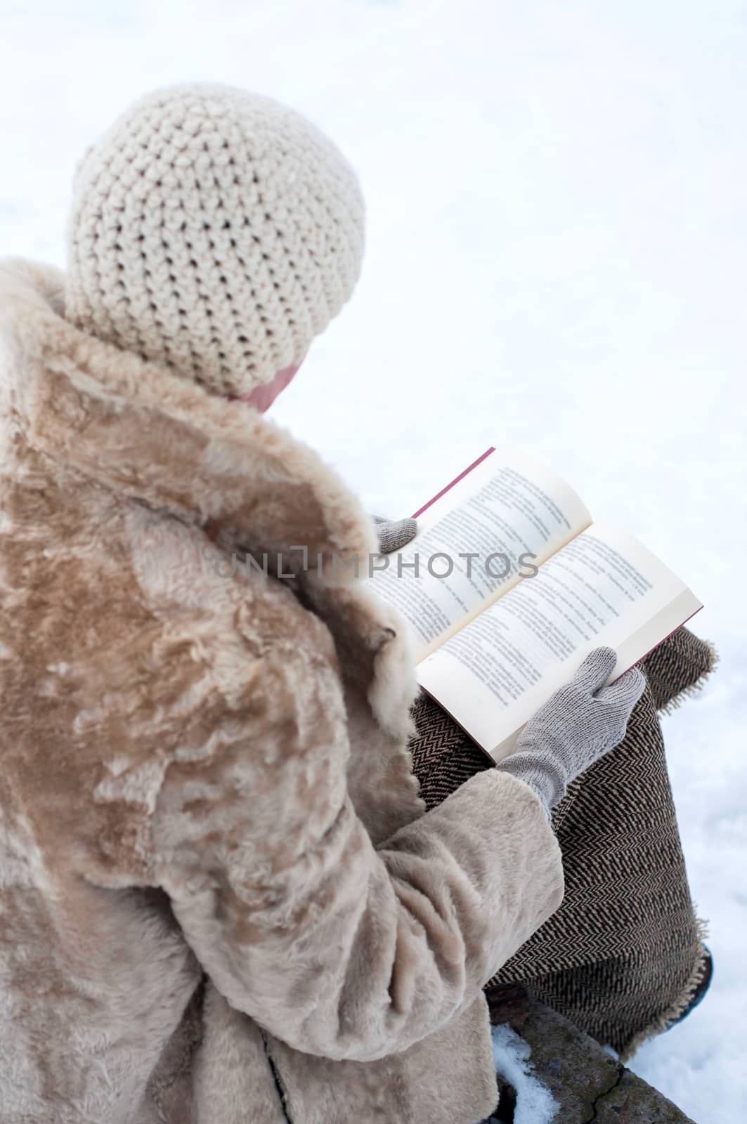 Woman ready a book in winter by MaxalTamor