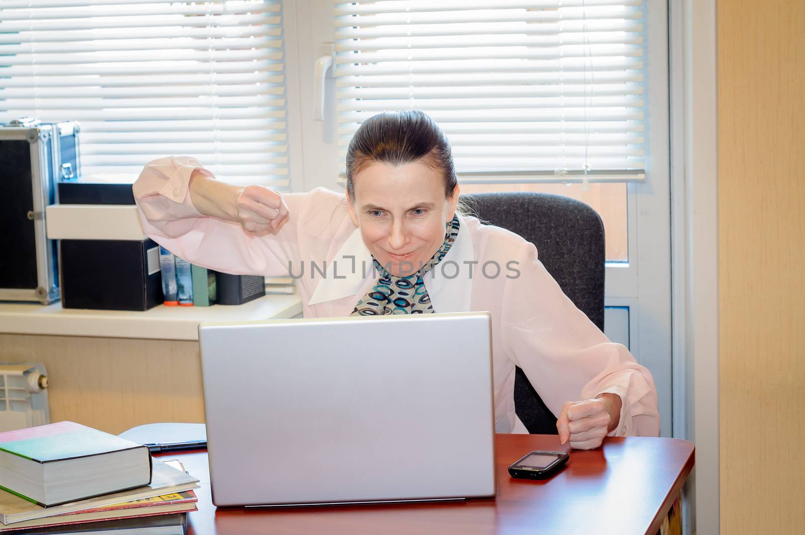 A fifty years old woman very angry with the modern technology