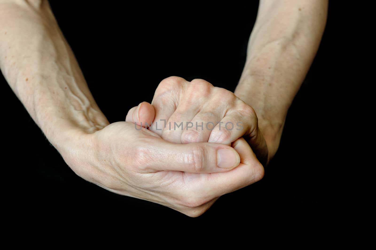 Different positions of senior woman's hands on black background