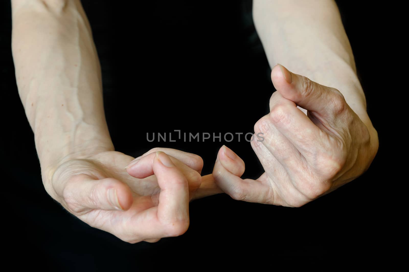 Different positions of senior woman's hands on black background