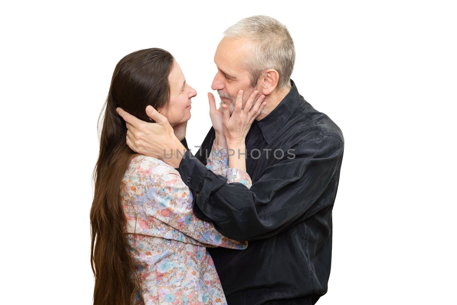 Mature man and woman with long hair looking at each other with love, eyes in eyes, for S. Valentine's day or anniversary. Isolated on white background.