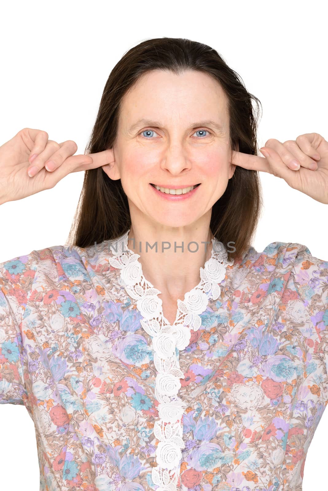 Smiling adult woman keeping the ears shut with her fingers, meaning she does not want to hear nothing or she is deaf