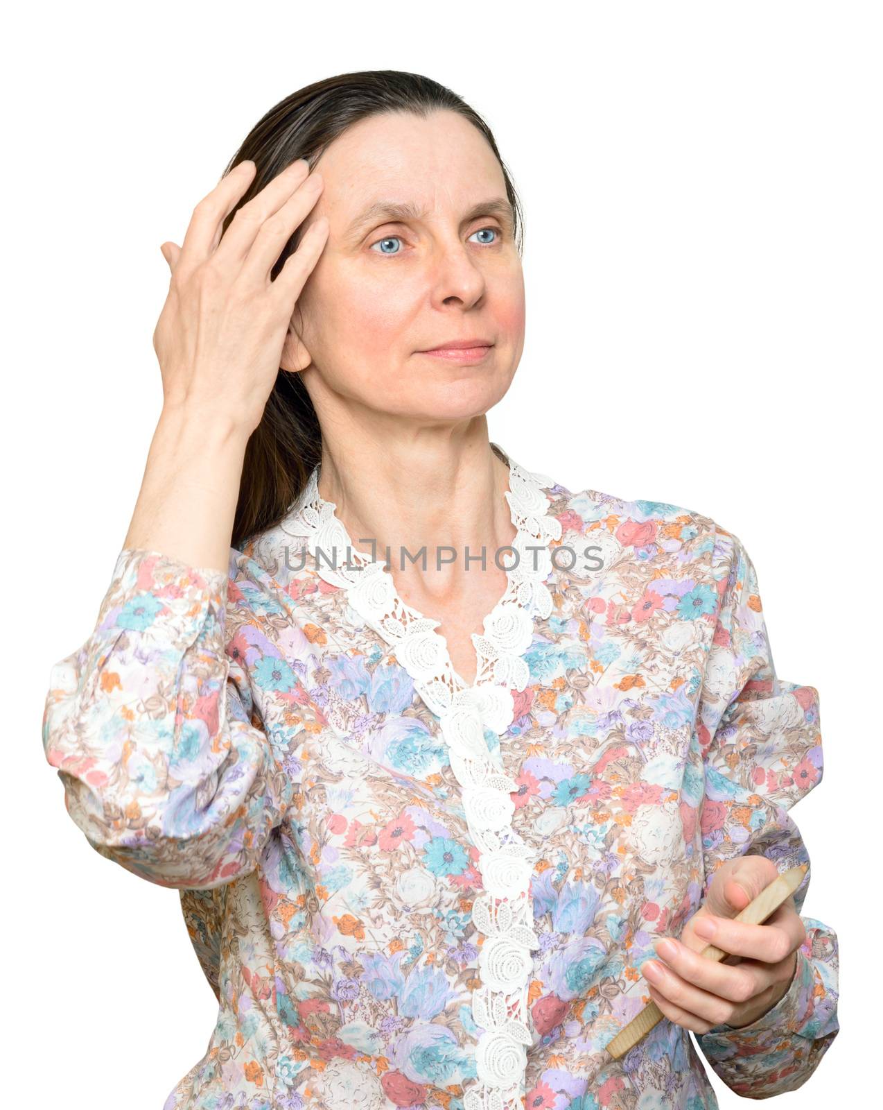 Adult woman combing long brown hair with a wooden comb, isolated on white background