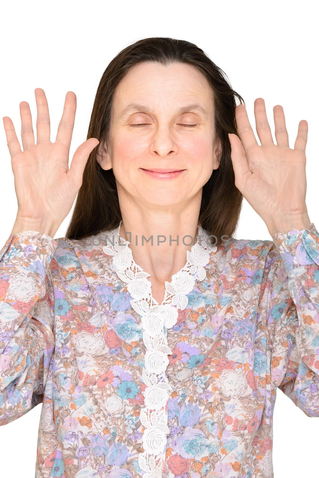 Smiling woman with closed eyes and open hands up showing the palms close to the face to express a lack of interest