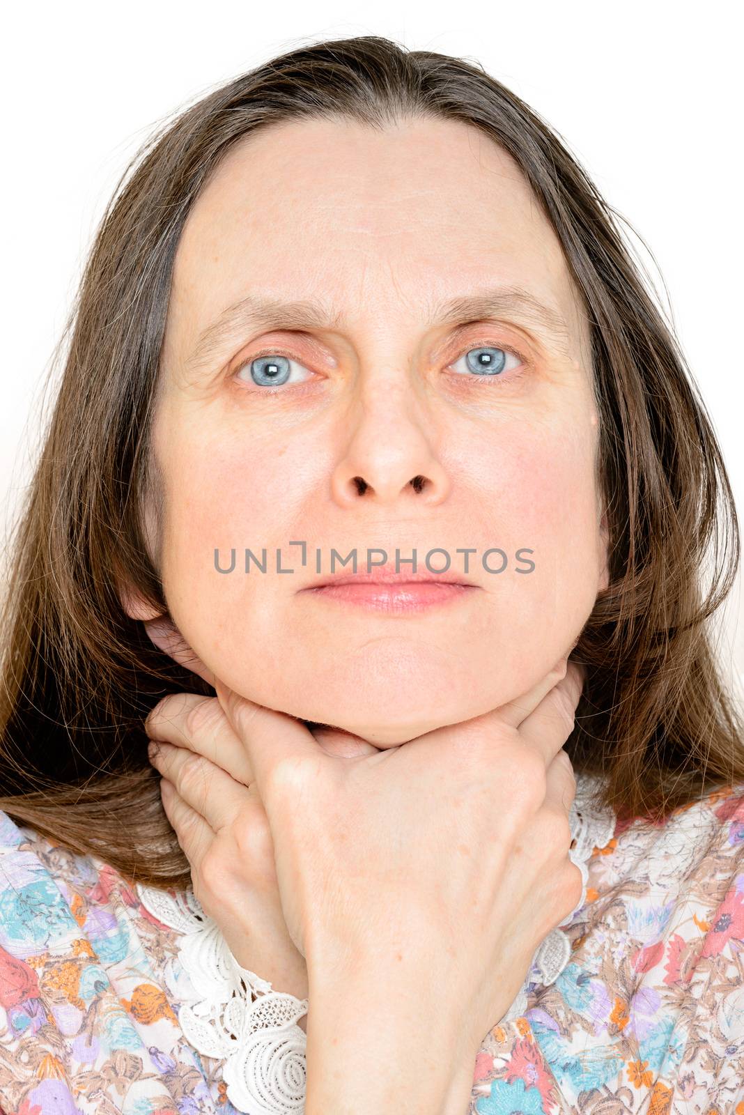 Adult woman with the hands around her neck, as if she wants to strangle herself, to symbolize sore throat