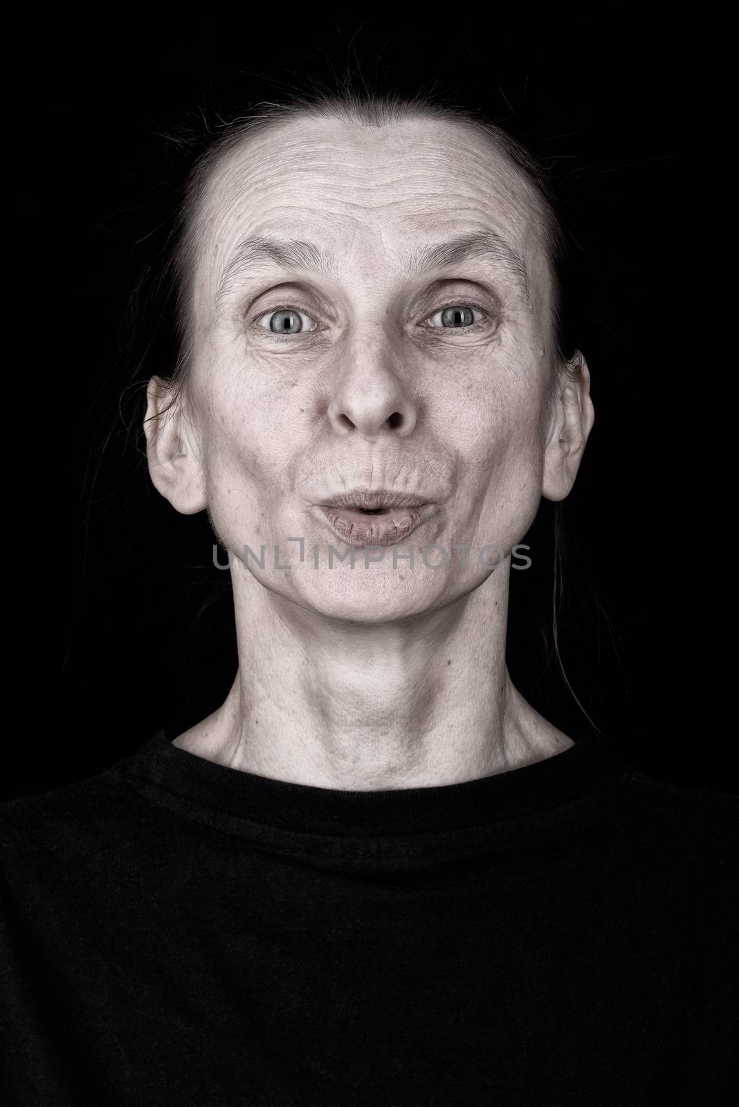 Positive Adult Woman Speaking or Sending a Kiss by MaxalTamor