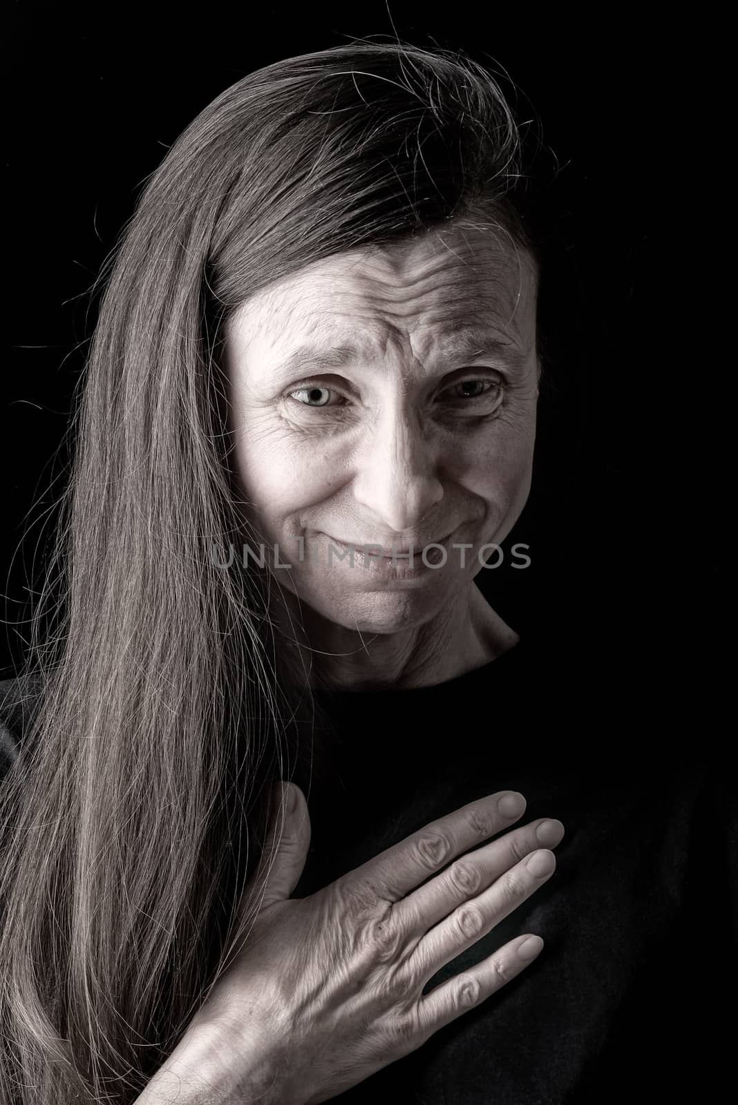 An adult woman with long hairhas nausea and put the right hand on her chest