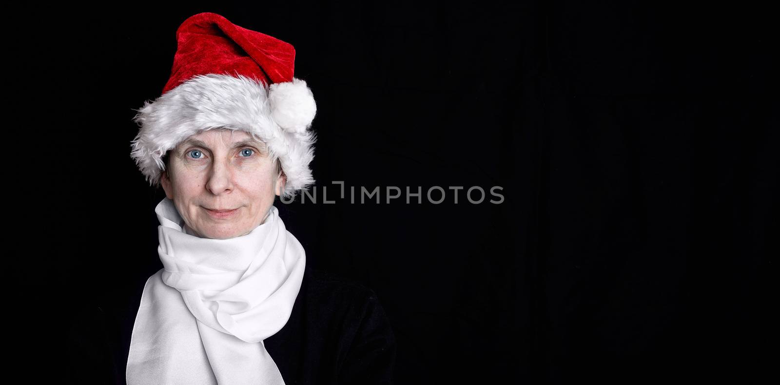 Portrait of an adult woman disguised in Santa Claus for the Christmas Holiday