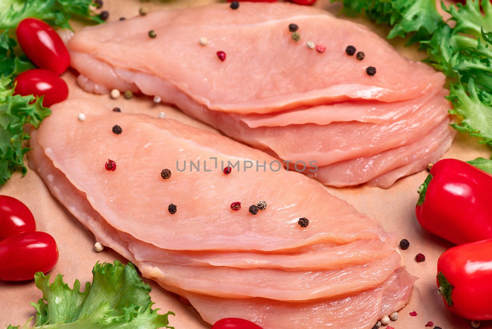 Raw sliced chicken meat close-up. Sotilissimo. Delicious dietary meat. Cooking,food of meat and fillets.Close-up view of raw, fresh, choped and sliced chicken meat.