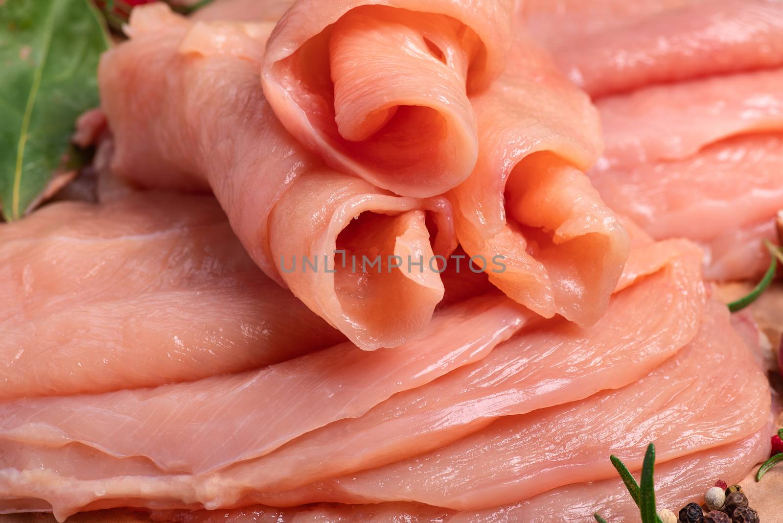 Raw sliced chicken meat close-up. Sotilissimo. Delicious dietary meat. Cooking.Close-up view of raw, fresh, choped and sliced chicken meat. by nkooume